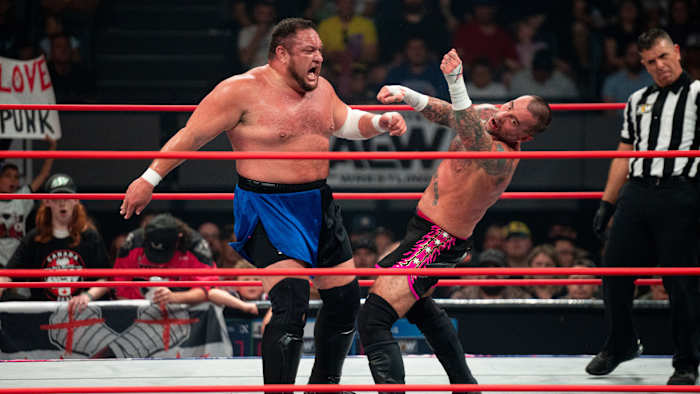 CM Punk flails after being hit by Samoa Joe